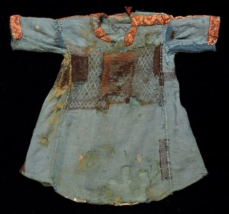 Child’s wool tunic, made from 11 pieces of fabric from 3 different sources; patched and darned. (Whitworth Art Gallery T.8549). [Source]. 