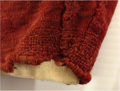 A child’s wool tunic featuring skilful darning in matching wool (Whitworth Art Gallery T.8375). [Photo: Faith Morgan]. 